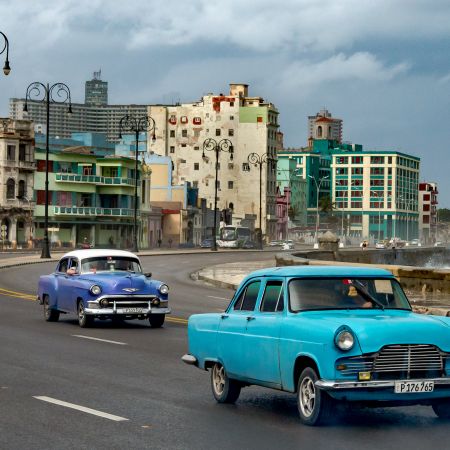 Classic cars on Havana avenue next to Malecon.