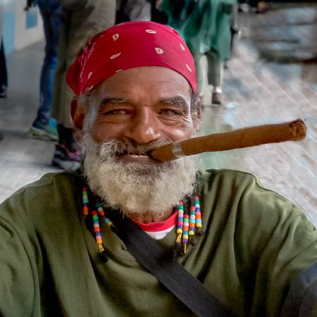 Cuban with long cigar in Havana.