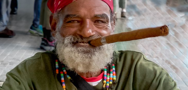 Cuban with long cigar in Havana.