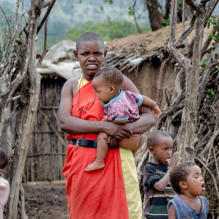 Mother and Child in traditional African dress in Maasai village.