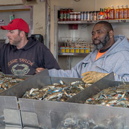 District of Columbia Fish Market with large bins of fresh crabs.