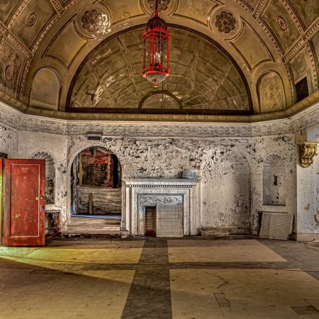 Lobby of Abandoned Theater in the Palace Style with red cut glass chandelier and plaster sculptured ceiiling