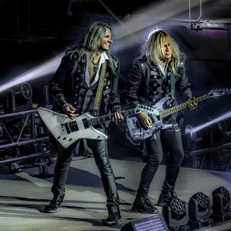 Joel Hoekstra and Chris Caffery perform on stage for Trans-Siberian Orchestra.